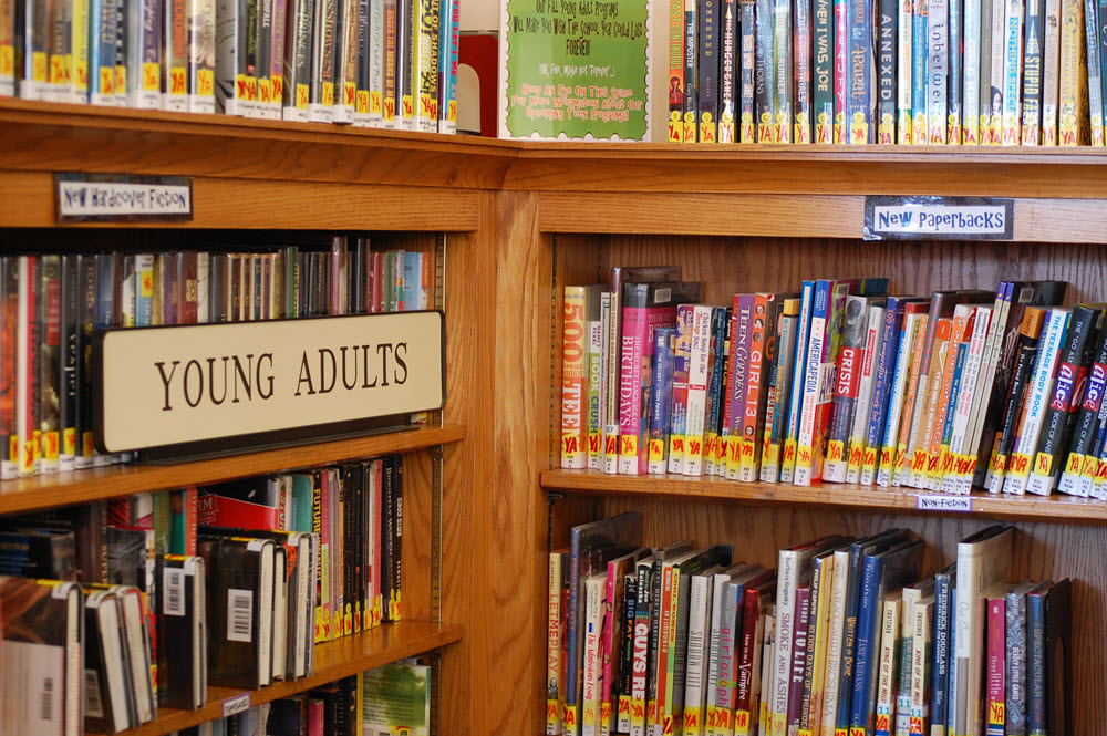 Photo of the young adult collection in the Salem Public Library in Salem, MA via Flickr. Used under CC 2.0.
