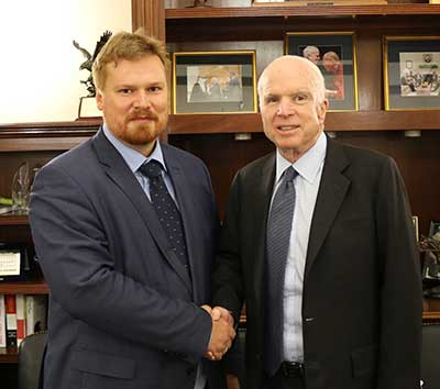 ASU McCain scholar Yaroslav Bekish shakes hands with Sen. John McCain