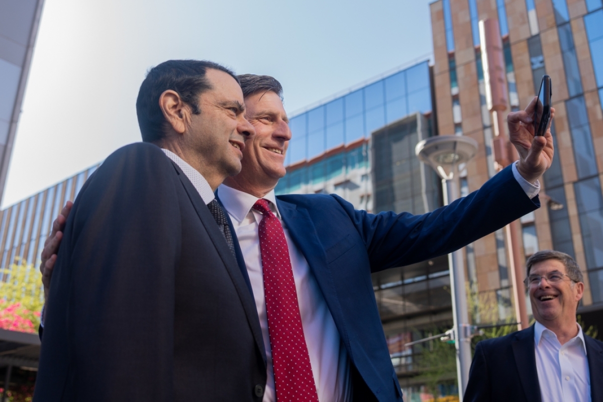 Two men in suit and ties take a selfie
