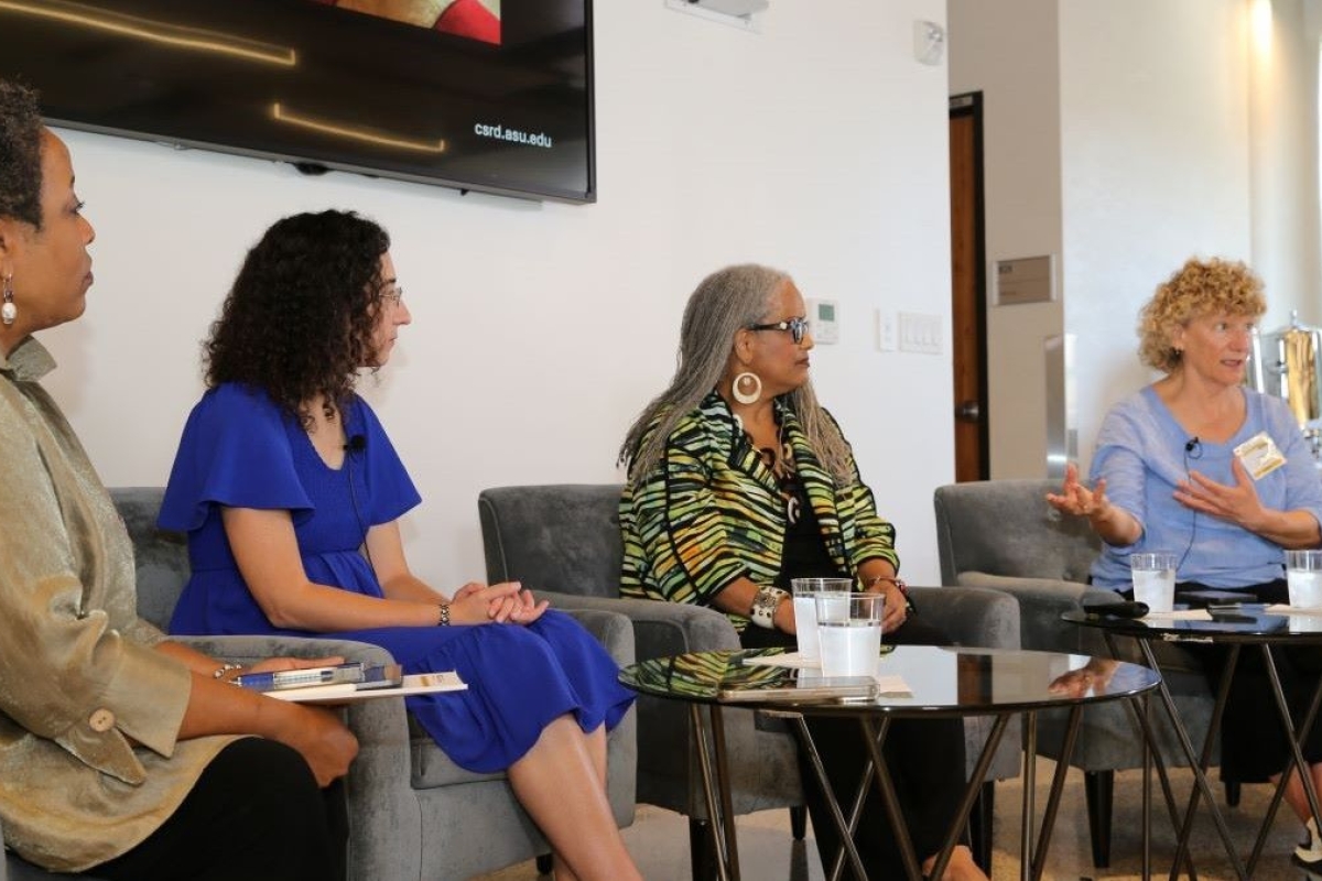 People seated for a panel discussion.