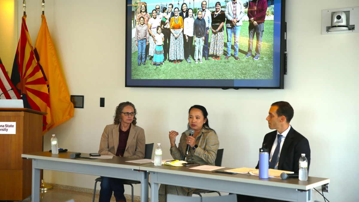 Panelists Ann Marie Bledsoe-Downes, Gary Gold, and Camille Touton speak to an unseen audience