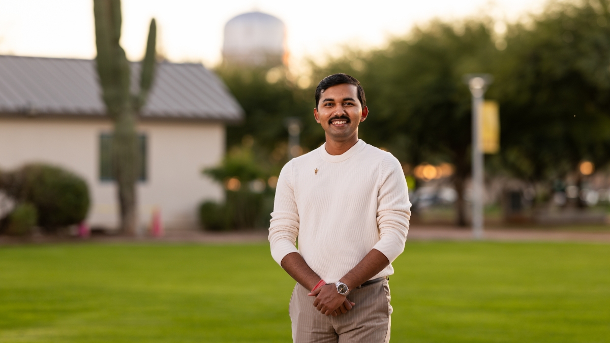 A man stands on the Polytechnic campus