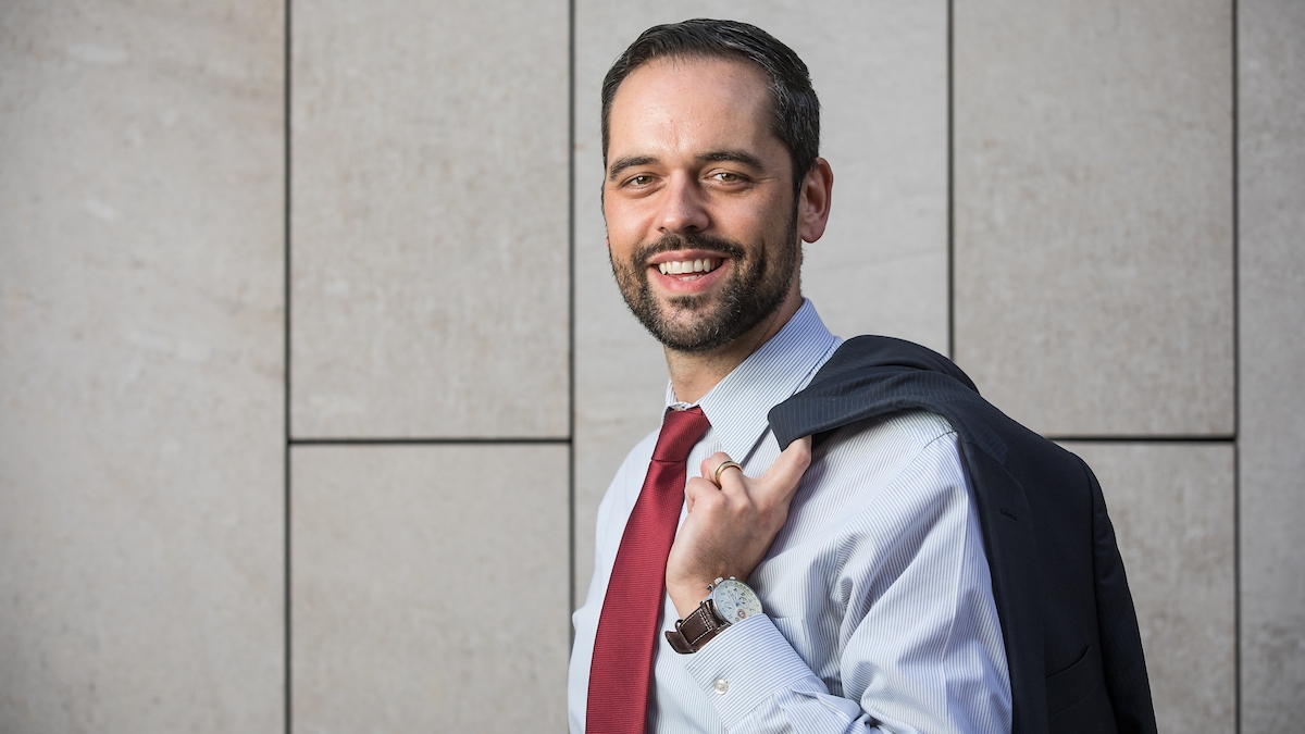 Man with jacket over his shoulder