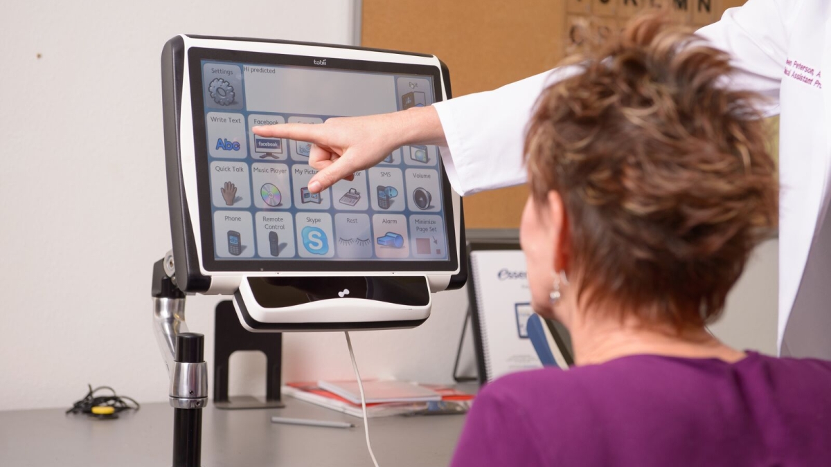 hand point to computer screen woman is looking at