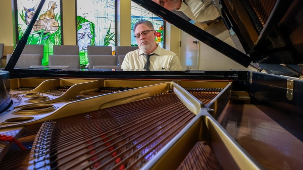 Man playing a piano.
