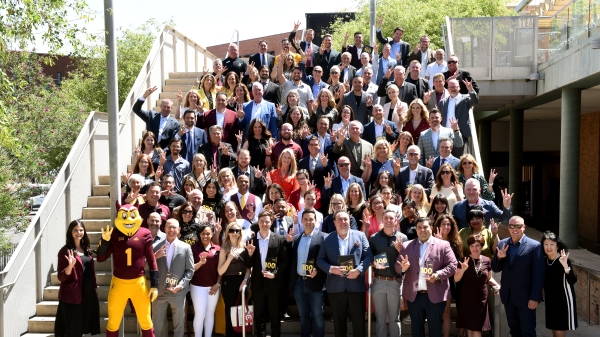Sun Devil 100 Class of 2025 poses for a photo on an outdoor staircase