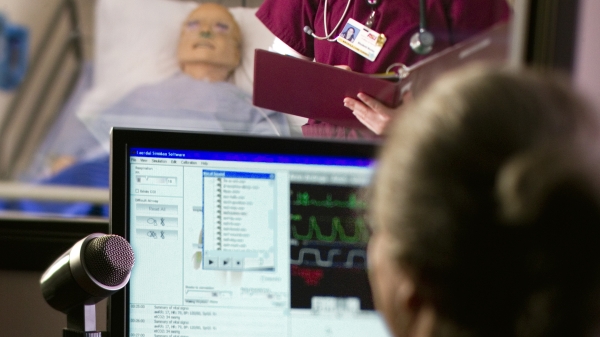nursing student practicing in a simulated environment 
