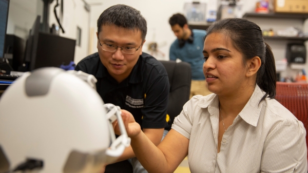 Professor and student working together in a lab