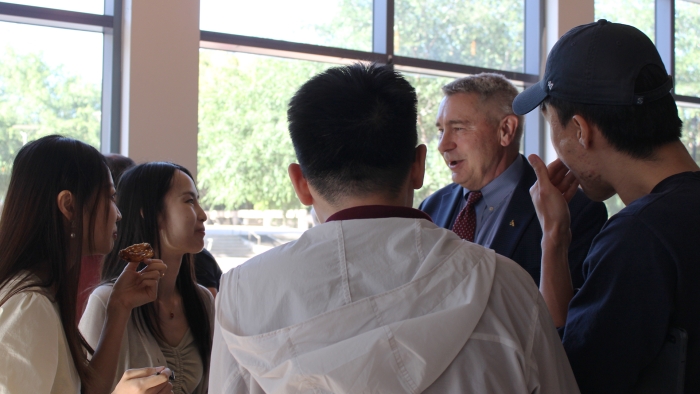 Students chat with G. Don Taylor at the reception